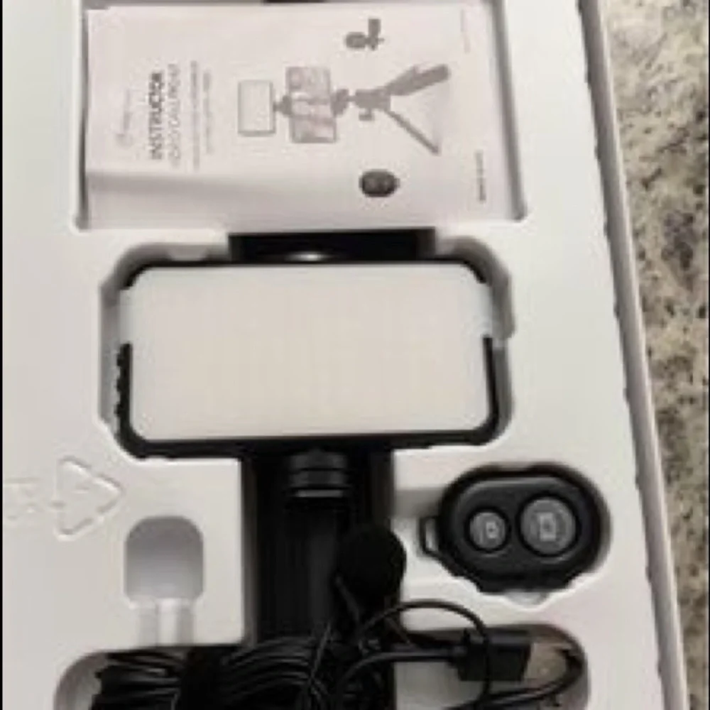 Tripod with light, microphone and Bluetooth remote brand new